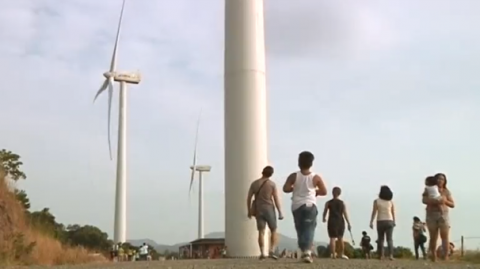 A wind farm draws in hundreds of tourists and provides revenue to a small farming province outside Manila.(photo grabbed from Reuters video)