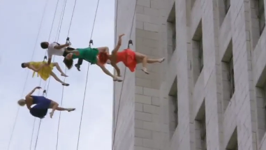 Brightly-dressed dancers abseil down Los Angeles City Hall as Mayor Eric Garcetti declares April 25 to be 'La La Land Day,' in honor of the Oscar-winning film. Photo grabbed from Reuters video file.