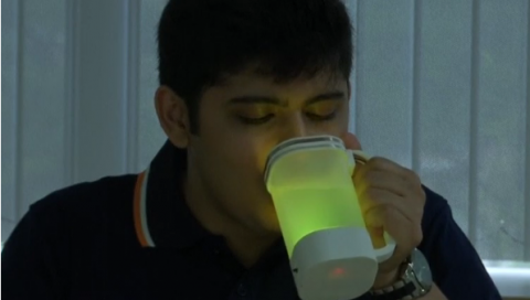 A research team in Singapore uses sensors and electrodes to make water look and taste like lemonade.(photo grabbed from Reuters video)