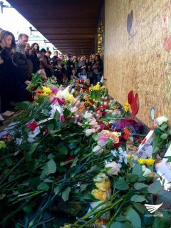 Flowers placed on the wall near the scene to remember Stockholm truck attack victims. (Eagle News Service)