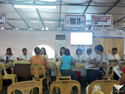Revenue officers accepting tax payments on Monday, April 17, the last day for the filing of taxes. (Photo by Aily Millo, Eagle News Service)