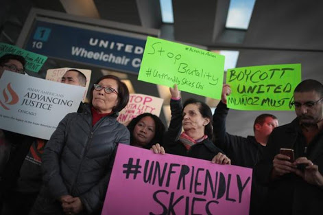 People have called for a boycott of United airlines after a Chinese doctor was dragged off the plane to make way for flight personnel. AFP
