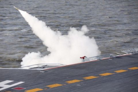 This picture taken on an undisclosed date in December 2016 shows a missile being fired from the Liaoning aircraft carrier during military drills in the Bohai Sea, off China's northeast coast. China's Liaoning aircraft carrier battle group has conducted its first exercises with live ammunition, the country's navy said, in a show of strength as tensions with the US and Taiwan escalate. China's first and only aircraft carrier led large-scale exercises in the Bohai Sea, the People's Liberation Army Navy said late on December 15, 2016 in a statement on their website. / AFP PHOTO / STR / China OUT