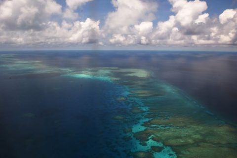 This photo taken on April 21, 2017 shows an aerial shot of part of mischief reef in the disputed Spratly islands on April 21, 2017. Philippine Defence Secretary Delfin Lorenzana flew to a disputed South China Sea island on April 21, brushing off a challenge by the Chinese military while asserting Manila's territorial claim to the strategic region. / AFP PHOTO / TED ALJIBE