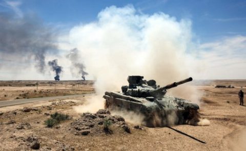 An Iraqi-modified T-72M tank belonging to the pro-government Hashed al-Shaabi (Popular Mobilisation) paramilitary forces advances towards the UNESCO-listed ancient city of Hatra, southwest of the northern city of Mosul, during an offensive to retake the area from Islamic State (IS) group fighters, on April 26, 2017. Hatra is the latest important archaeological site to be recaptured from IS. Jihadists had embarked on a campaign of destruction against archaeological sites after they seized swathes of Iraq and Syria in a lightning 2014 offensive. The full extent of the harm to Hatra remains unclear. / AFP PHOTO / AHMAD AL-RUBAYE