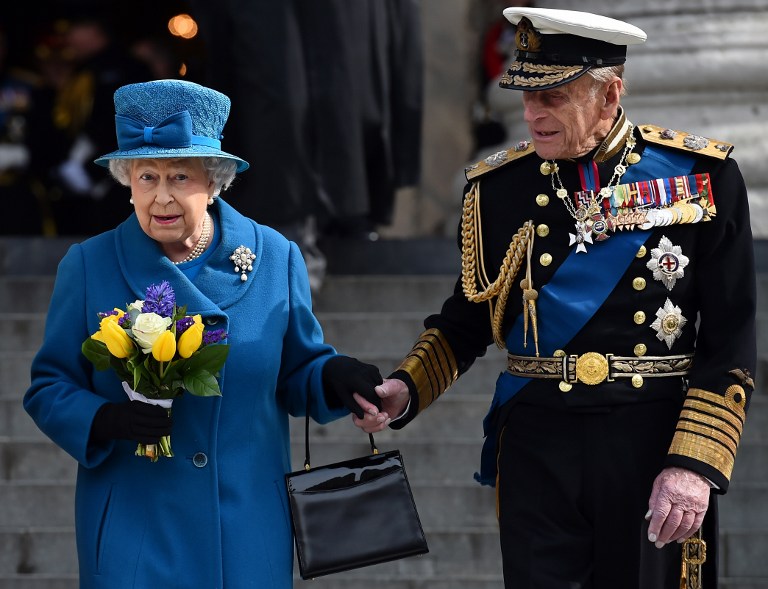 (FILES) This file photo taken on March 13, 2015 shows Britain's Queen Elizabeth II (L) and Britain's Prince Philip, Duke of Edinburgh, leaving St Paul's Cathedral in London after attending a memorial service to mark the end of Britain's combat operations in Afghanistan. Britain's Prince Philip, the 95-year-old husband of Queen Elizabeth II, will retire from public engagements later this year, Buckingham Palace said on May 4, 2017. / AFP PHOTO / BEN STANSALL