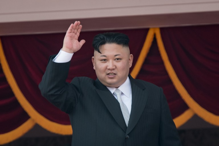 (FILES) This file photo taken on April 15, 2017 shows North Korean leader Kim Jong-Un waving from a balcony of the Grand People's Study house following a military parade marking the 105th anniversary of the birth of late North Korean leader Kim Il-Sung, in Pyongyang. North Korea on May 5, 2017 accused the CIA of plotting with South Korea to assassinate the isolated country's leader Kim Jong-Un, amid soaring tensions in the flashpoint region. / AFP PHOTO / ED JONES