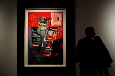 A man looks at Jean-Michel Basquiat "La Hara" during Christie's press preview of the 20th Century Week, in New York on May 5, 2017. Christie's and Sotheby's are currently holding their Spring Auction previews. / AFP PHOTO / Jewel SAMAD / The erroneous mention[s] appearing in the metadata of this photo by Jewel SAMAD has been modified in AFP systems in the following manner: [Jean-Michel Basquiat "La Hara"] instead of [Cy Twombly's "Leda and the Swan"]. Please immediately remove the erroneous mention[s] from all your online services and delete it (them) from your servers. If you have been authorized by AFP to distribute it (them) to third parties, please ensure that the same actions are carried out by them. Failure to promptly comply with these instructions will entail liability on your part for any continued or post notification usage. Therefore we thank you very much for all your attention and prompt action. We are sorry for the inconvenience this notification may cause and remain at your disposal for any further information you may require.