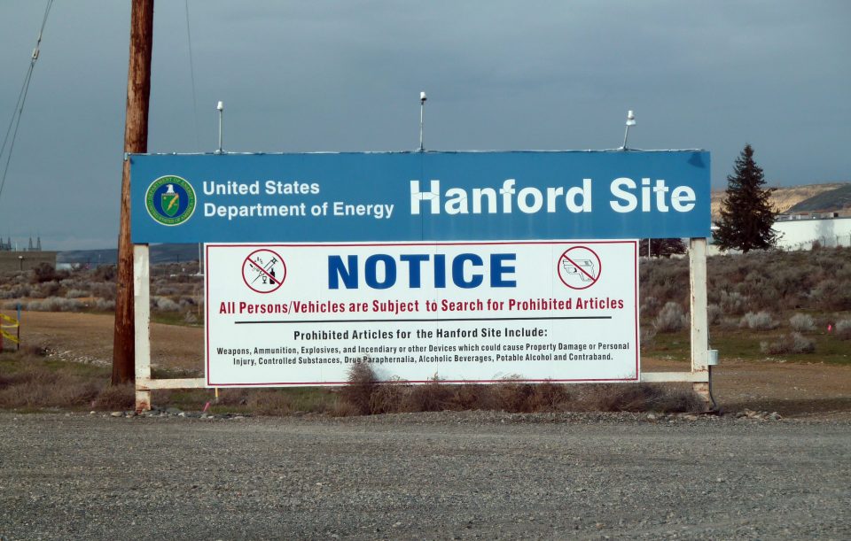 (FILES) This file photo taken on March 17, 2011 shows a sign warning visitors of searches for prohibited materials as they near the Hanford nuclear site in Hanford, Washington. Hundreds of workers at the nuclear site were ordered to take cover on May 9, 2017, after a tunnel filled with contaminated material collapsed near the facility, federal officials said. Employees at the Hanford Site plant, located about 170 miles (275 kilometers) southeast of downtown Seattle, were sent an alert by management in early morning telling them to "secure ventilation" and refrain from "eating or drinking." / AFP PHOTO / SHAUN TANDON