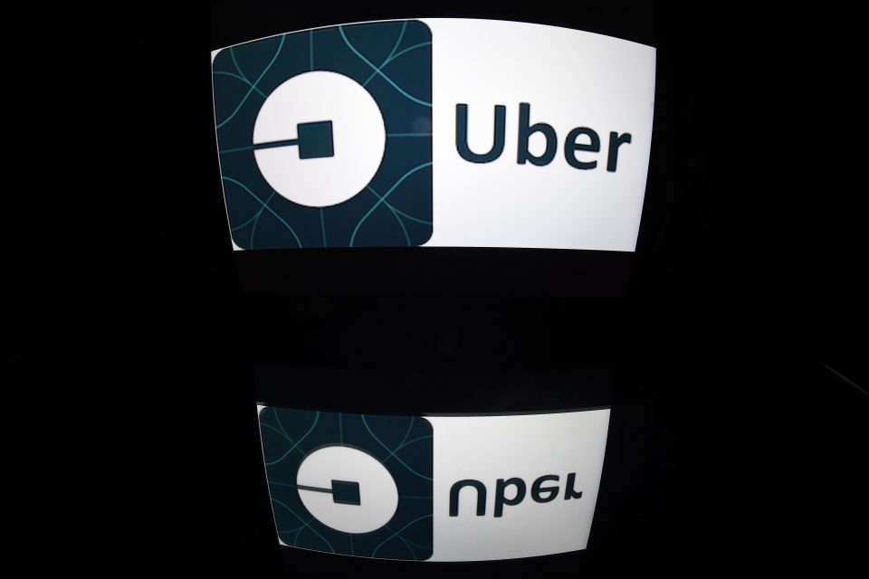 (FILES) This file photo taken on December 28, 2016 shows the logo of Uber in Paris. Ride-hailing app Uber may be a pioneer in its field but at heart it is an ordinary taxi company and should be regulated as such, a top EU lawyer said on May 11, 2017. / AFP PHOTO / Lionel BONAVENTURE