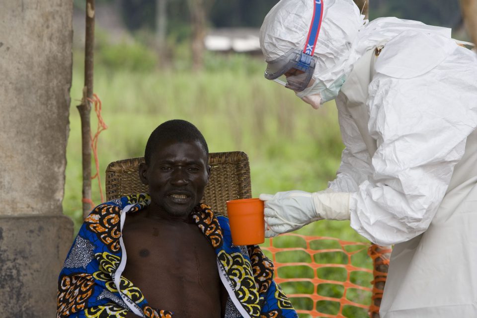 At the Mdecins Sans Frontires (MSF) isolation ward In Kampungu, in the health district of Luebo,  a 43 year old patient who has been laboratory confirmed to have Ebola haemorrhagic fever(EHF) is comforted by MSF Belgium Dr Hilde Declerck. EHF is a febrile haemorrhagic illness which causes death in 50-90% of all clinically ill cases.