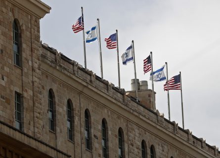 Israeli and US national flags are seen on top of the King David Hotel, where US President Donald Trump will be staying, in downtown Jerusalem, on May 19, 2017, three days ahead of his two day official visit in Israel and the Palestinian territories. / AFP PHOTO / THOMAS COEX