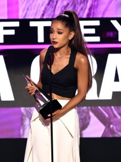 (FILES) This file photo taken on November 20, 2016 shows US singer Ariana Grande accepting the Artist of the Year award during the 2016 American Music Awards Los Angeles, California. British police said early May 23, 2017, that there were "a number of confirmed fatalities" after reports of at least one explosion during concert by Ariana Grande in the city of Manchester. / AFP PHOTO / GETTY IMAGES NORTH AMERICA / KEVIN WINTER