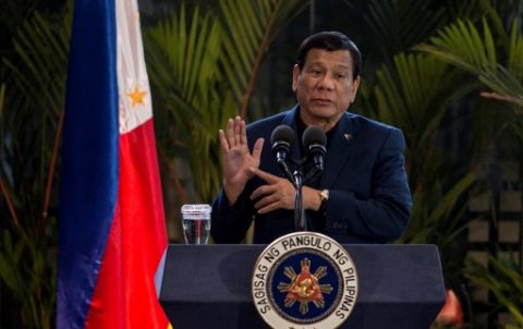 Philippine President Rodrigo Duterte speaks during a press conference at Manila international airport in Manila on May 24, 2017, after returning from a visit to Russia. Duterte threatened on May 24 to impose martial law nationwide to combat the rising threat of terrorism, after Islamist militants beheaded a policeman and took Catholic hostages while rampaging through a southern city. / AFP PHOTO / NOEL CELIS