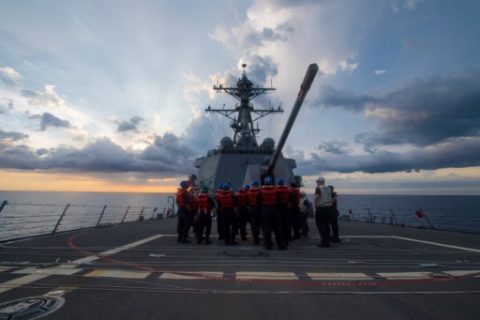 US sailors receive a safety brief on the Arleigh Burke-class guided-missile destroyer USS Dewey prior to a replenishment-at-sea on May 6, 2017, in the South China Sea. The USS Dewey sailed in disputed South China Sea waters near a reef claimed by Beijing, a US official said on May 24, 2017. Dewey sailed "less than 12 nautical miles" from Mischief Reef, part of the the Spratly Islands, in a "freedom of navigation operation," the official said. It is Washington's first such exercise under the administration of US President Donald Trump. / AFP PHOTO / US NAVY / Kryzentia Weiermann / RESTRICTED TO EDITORIAL USE - MANDATORY CREDIT "AFP PHOTO / US Navy / Mass Communication Specialist 3rd Class Kryzentia Weiermann" - NO MARKETING NO ADVERTISING CAMPAIGNS - DISTRIBUTED AS A SERVICE TO CLIENTS
