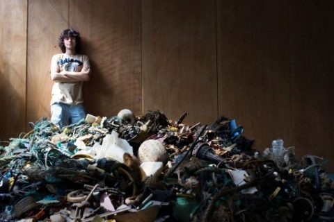 TO GO WITH AFP STORY BY NICOLAS DELAUNAY A handout photo released by the Dutch Organization "The Ocean Cleanup" on July 2, 2014 shows Dutch student Boyan Slat, 19, posing by a pile of garbage found in the sea, in October 2013 in Delft. Slat is only 19 years old, but he already has 100 people working on his revolutionary plan to scoop thousands of tonnes of damaging plastics from the oceans. The world's 'plastic soup', much of it swirling around in five main gyres or rotating oceanic currents, causes billions of euros (dollars) in damage every year. AFP PHOTO / HO / THE OCEAN CLEANUP = RESTRICTED TO EDITORIAL USE - MANDATORY CREDIT "AFP PHOTO / THE OCEAN CLEANUP" - NO MARKETING NO ADVERTISING CAMPAIGNS - DISTRIBUTED AS A SERVICE TO CLIENTS = / AFP PHOTO / THE OCEAN CLEANUP / -