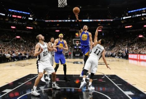 SAN ANTONIO, TX - MAY 22: Stephen Curry #30 of the Golden State Warriors drives to the basket in the first half against Bryn Forbes #11 of the San Antonio Spurs during Game Four of the 2017 NBA Western Conference Finals at AT&T Center on May 22, 2017 in San Antonio, Texas. NOTE TO USER: User expressly acknowledges and agrees that, by downloading and or using this photograph, User is consenting to the terms and conditions of the Getty Images License Agreement. Ronald Cortes/Getty Images/AFP