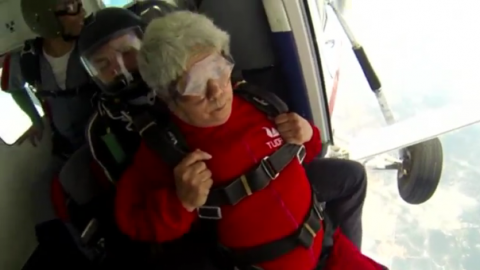 A grandma from northeast China's Heilongjiang Province challenged people's concept of the elderly people's lifestyle and became an internet hit by parachute jumping from an altitude of 4,000 meters.(photo grabbed from Reuters video)