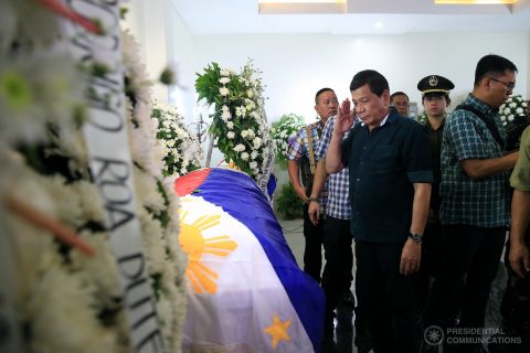 resident Rodrigo Duterte salutes the remains of Sergeant Marlon Baldovino during a wake visit at the St. Peter’s Funeral Homes in Iligan City on May 26, 2017. Baldovino was killed when terrorists attacked Marawi City on May 23, 2017. PRESIDENTIAL PHOTO
