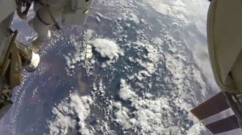 NASA released action camera video shot by astronauts on a spacewalk outside the International Space Station (ISS).(photo grabbed from Reuters video)