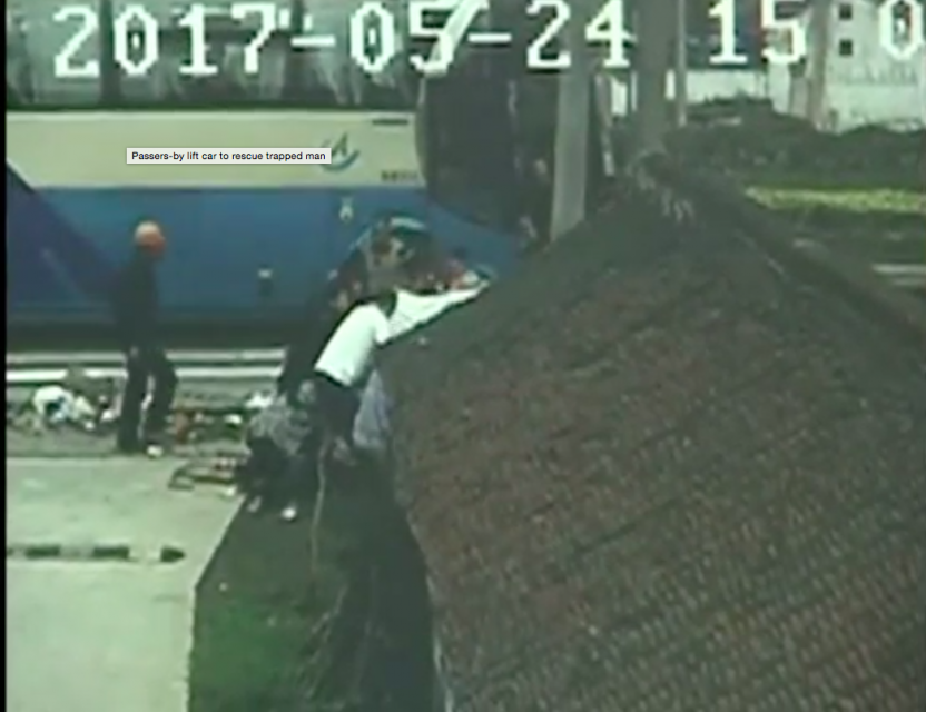 A car hit a tricycle at a crossroads in Haimen City of east China's Jiangsu Province on Wednesday, leaving the tricycle driver trapped underneath the car, as shown by footage from roadside monitoring cameras. Photo grabbed from Reuters video file.