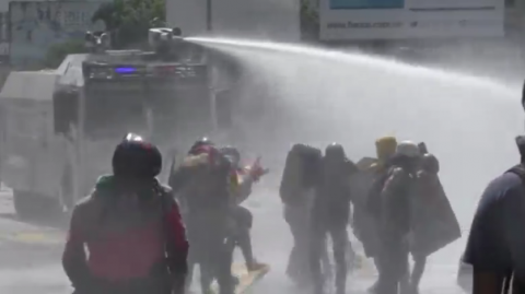  Venezuela's National Guard used tear gas and a water canon on protesters in Caracas on Thursday (May 18) as tensions spilled over after a march against President Nicolas Maduro's interior minister was blockaded by armored vehicles.(photo grabbed from Reuters video)