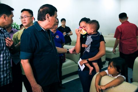 President Rodrigo Duterte condoles with Mary Ann, partner of the late Alan Descallar, during a wake visit at the St. Peter’s Funeral Homes in Iligan City on May 26, 2017. Descallar is a civilian who was killed when terrorists attacked Marawi City on May 23, 2017. PRESIDENTIAL PHOTO