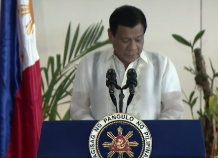 President Rodrigo Duterte reads a prepared speech before boarding a plane that will bring him and his high-level Philippine delegation to Russia for his four-day landmark visit. (Photo grabbed from RTVM video)
