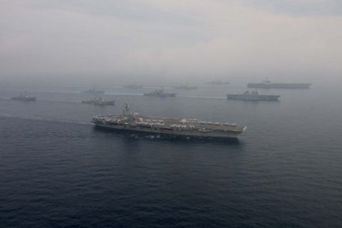This handout photo taken and released by the US Navy on June 1, 2017 shows the Carl Vinson strike group, including the USS Carl Vinson (C), operating with the Ronald Reagan strike group, including the USS Ronald Reagan (top R), during navel drills with Japanese ships in the Sea of Japan (also known as the East Sea), off the Korean peninsula where a North Korean missile landed during a test fire on May 29. A pair of US aircraft carriers and Japanese naval vessels conducted a joint drill in waters off the Korean peninsula on June 1, in an apparent show of force days after the latest North Korean ballistic missile test. / AFP PHOTO / US NAVY / Kenneth Abbate / -----EDITORS NOTE --- RESTRICTED TO EDITORIAL USE - MANDATORY CREDIT "AFP PHOTO / US NAVY / Mass Communications Specialist 2nd Class Kenneth Abbate" - NO MARKETING - NO ADVERTISING CAMPAIGNS - DISTRIBUTED AS A SERVICE TO CLIENTS
