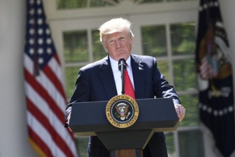 US President Donald Trump announces his decision to withdraw the US from the Paris Climate Accords in the Rose Garden of the White House in Washington, DC, on June 1, 2017. "As of today, the United States will cease all implementation of the non-binding Paris accord and the draconian financial and economic burdens the agreement imposes on our country," Trump said. / AFP PHOTO / SAUL LOEB