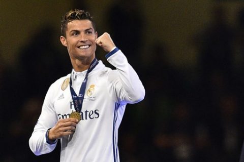 Real Madrid's Cristiano Ronaldo celebrates after Real Madrid won the UEFA Champions League final football match between Juventus and Real Madrid at The Principality Stadium in Cardiff, south Wales, on June 3, 2017. / AFP PHOTO / Glyn KIRK