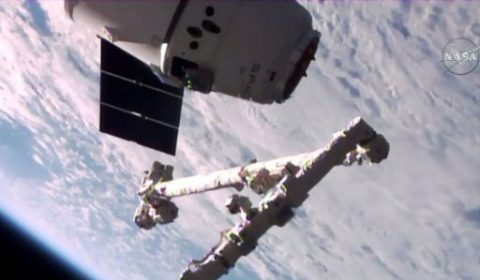 This NASA TV video grab obtained June 5, 2017 shows the SpaceX Dragon seen seconds away from its capture with the Canadarm2 robotic arm. SpaceX's first-ever recycled spaceship arrived June 5, 2017 at the International Space Station, two days after the unmanned Dragon cargo capsule launched atop a Falcon 9 rocket from Cape Canaveral, Florida. Live images on NASA television showed the spaceship approaching the orbiting outpost, then being grabbed with the station's robotic arm at 9:52 am (1352 GMT)."Capture complete," said NASA astronaut Peggy Whitson, who operated the robotic arm from inside the station. / AFP PHOTO / NASA TV / Handout / RESTRICTED TO EDITORIAL USE - MANDATORY CREDIT "AFP PHOTO / NASA TV/HANDOUT" - NO MARKETING NO ADVERTISING CAMPAIGNS - DISTRIBUTED AS A SERVICE TO CLIENTS