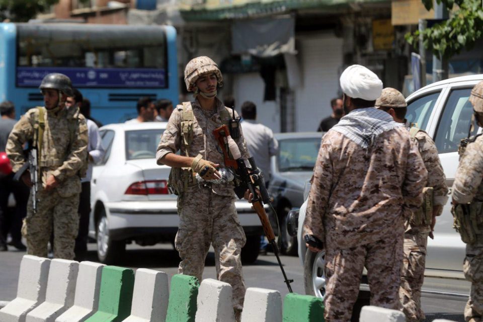Members of the Iranian Revolutionary Guard secure the area outside the Iranian parliament during an attack on the complex in the capital Tehran on June 7, 2017. Gunmen and suicide bombers carried out coordinated attacks on Iran's parliament and the tomb of revolutionary founder Ruhollah Khomeini on June 7, 2017, state media reported, killing at least three people. / AFP PHOTO / FARS NEWS / Hossein MERSADI