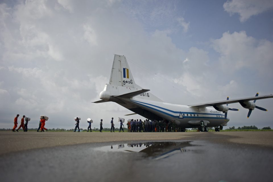 (FILES) This file photo taken on August 5, 2015 shows a Myanmar Air Force Shaanxi Y-8 transport aircraft being unloaded at Sittwe airport in Rakhine state, similar to the aircraft carrying over 100 people that went missing between the southern city of Myeik and Yangon on June 7, 2017. A Myanmar military plane carrying at least 104 people went missing on June 7, 2017 between the southern city of Myeik and Yangon, the army chief's office said, as ships scoured the Andaman sea for the aircraft. / AFP PHOTO / Ye Aung Thu
