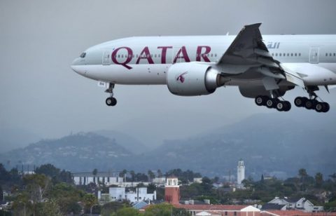 (FILES) This file photo taken on March 21, 2017 shows a Qatar Airways aircraft, flight 739 from Doha, coming in for a landing at Los Angeles International Airport in Los Angeles, California.  Qatar Airways has made Doha a global hub in just a few years, but barring it from Gulf states' airspace threatens its position as a major transcontinental carrier, experts say. / AFP PHOTO / FREDERIC J. BROWN