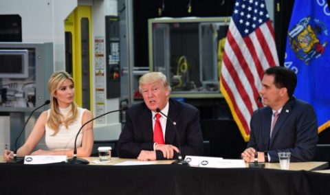 US President Donald Trump and his daughter Ivanka (L) chair a workforce development roundtable discussion with Wisconsin Governor Scott Walker (R) at Waukesha County Technical College during a visit in Milwaukee, Wisconsin on June 13, 2017. / AFP PHOTO / Nicholas Kamm
