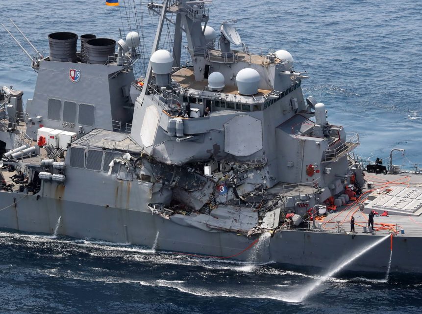 Damage is seen on the guided missile destroyer USS Fitzgerald off the Shimoda coast, after it collided with a Philippine-flagged container ship, on June 17, 2017. Seven US sailors were missing and a skipper injured after their Navy destroyer collided with a container ship off the coast of Japan early on June 17, with the badly damaged US vessel partially flooded. / AFP PHOTO / JIJI PRESS / STR / Japan OUT