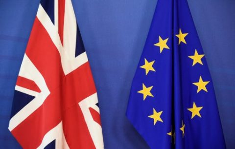 A Union Jack (L) and a flag of the European Union are seen at the European Commission in Brussels on June 19, 2017, as Britain starts formal talks to leave the EU. Britain starts formal talks to leave the EU on Monday, seeking a deal "like no other in history" despite entering fiendishly difficult negotiations with a badly weakened government. / AFP PHOTO / JOHN THYS