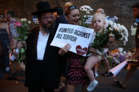 People gather to attend a vigil outside Finsbury Park Mosque, close to the scene of a van attack in Finsbury Park, north London on June 19, 2017. Ten people were injured when a van drove into a crowd of Muslim worshippers near a mosque in London in the early hours of Monday, and a man who had been taken ill before the attack died at the scene. / AFP PHOTO / Isabel INFANTES