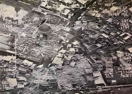 (FILES) This aerial view taken on June 21, 2017 and provided by Iraq's Joint Operation Command reportedly shows destruction inside Mosul's Nuri mosque compound. Jihadists blew up Mosul's iconic leaning minaret and the adjacent Nuri mosque where their leader Abu Bakr al-Baghdadi declared a "caliphate" in his only public appearance in 2014, an Iraqi commander said. The Islamic State group swiftly issued a statement via its Amaq propaganda agency blaming a US strike for the destruction of the Nuri mosque and the historic leaning Hadba minaret in its vicinity. / AFP PHOTO / Joint Operation Command / HO