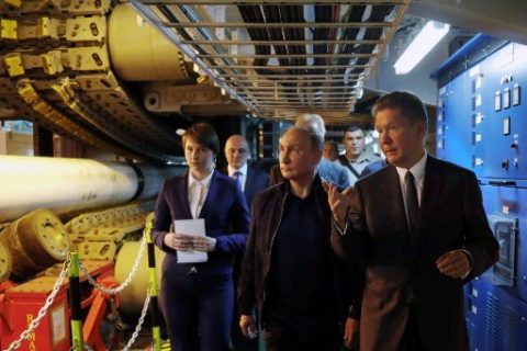 Russian President Vladimir Putin (C), accompanied by Gazprom Chief Executive Officer Alexei Miller (R), visits the Pioneering Spirit pipelaying ship in the Black Sea on June 23, 2017. Russian President Vladimir Putin on Friday launched the deep-water phase of the TurkStream gas pipeline project, calling Turkey's Recep Tayyip Erdogan from a ship off the Black Sea coast. TurkStream will deliver Russian gas to Turkey and is eventually intended to serve the European Union.  / AFP PHOTO / SPUTNIK / Mikhail METZEL