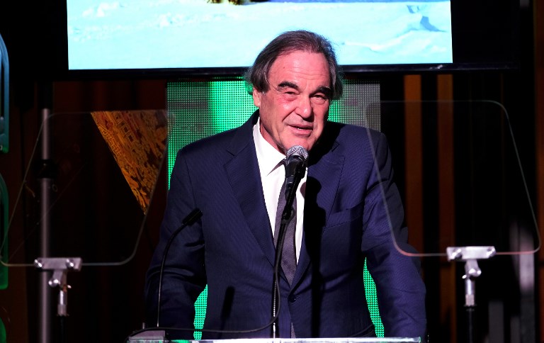 FILE PHOTO: LOS ANGELES, CA - FEBRUARY 22: Filmmaker Oliver Stone speaks onstage during the 14th Annual Global Green Pre Oscar Party at TAO Hollywood on February 22, 2017 in Los Angeles, California. Frazer Harrison/Getty Images for Global Green/AFP