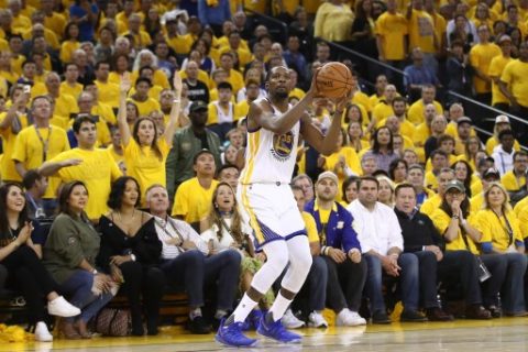 OAKLAND, CA - JUNE 01: Kevin Durant #35 of the Golden State Warriors attempts a jump shot against the Cleveland Cavaliers in Game 1 of the 2017 NBA Finals at ORACLE Arena on June 1, 2017 in Oakland, California. NOTE TO USER: User expressly acknowledges and agrees that, by downloading and or using this photograph, User is consenting to the terms and conditions of the Getty Images License Agreement. Ezra Shaw/Getty Images/AFP