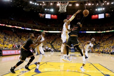 OAKLAND, CA - JUNE 04: David West #3 of the Golden State Warriors defends a shot by Kyrie Irving #2 of the Cleveland Cavaliers in Game 2 of the 2017 NBA Finals at ORACLE Arena on June 4, 2017 in Oakland, California. NOTE TO USER: User expressly acknowledges and agrees that, by downloading and or using this photograph, User is consenting to the terms and conditions of the Getty Images License Agreement. Ezra Shaw/Getty Images/AFP
