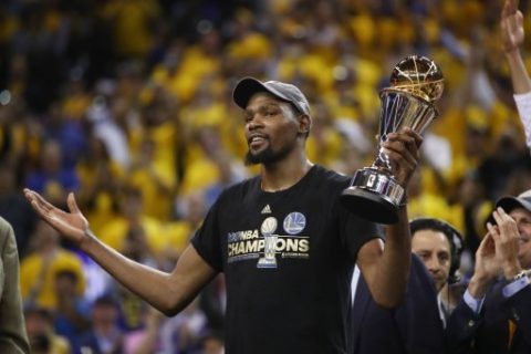 OAKLAND, CA - JUNE 12: Kevin Durant #35 of the Golden State Warriors celebrates after being named Bill Russell NBA Finals Most Valuable Player after defeating the Cleveland Cavaliers 129-120 in Game 5 to win the 2017 NBA Finals at ORACLE Arena on June 12, 2017 in Oakland, California. NOTE TO USER: User expressly acknowledges and agrees that, by downloading and or using this photograph, User is consenting to the terms and conditions of the Getty Images License Agreement. Ezra Shaw/Getty Images/AFP