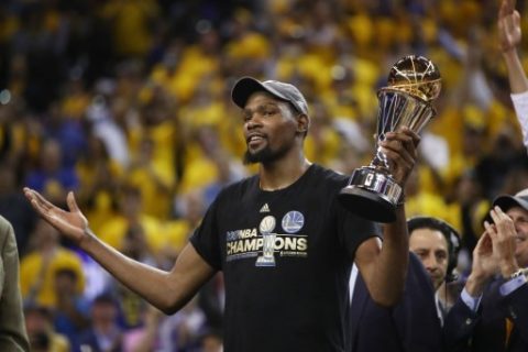 OAKLAND, CA - JUNE 12: Kevin Durant #35 of the Golden State Warriors celebrates after being named Bill Russell NBA Finals Most Valuable Player after defeating the Cleveland Cavaliers 129-120 in Game 5 to win the 2017 NBA Finals at ORACLE Arena on June 12, 2017 in Oakland, California. NOTE TO USER: User expressly acknowledges and agrees that, by downloading and or using this photograph, User is consenting to the terms and conditions of the Getty Images License Agreement.   Ezra Shaw/Getty Images/AFP