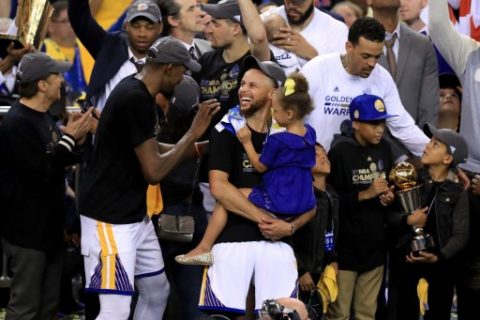 OAKLAND, CA - JUNE 12: Kevin Durant #35 and Stephen Curry #30 of the Golden State Warriors celebrate after defeating the Cleveland Cavaliers 129-120 in Game 5 to win the 2017 NBA Finals at ORACLE Arena on June 12, 2017 in Oakland, California. NOTE TO USER: User expressly acknowledges and agrees that, by downloading and or using this photograph, User is consenting to the terms and conditions of the Getty Images License Agreement. Ronald Martinez/Getty Images/AFP