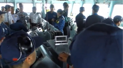 Officers crowding around the bridge of the Izumo, including ASEAN military officers. (Photo grabbed from the Reuters video) 