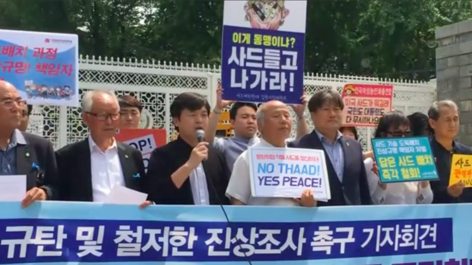 South Korea's civil society groups gathered outside the Ministry of National Defense of the Republic of Korea (ROK) in Seoul on Wednesday to protest the unauthorized transportation of components of the U.S. Terminal High Altitude Area Defense (THAAD) system into the country. Photo grabbed from Reuters video file.