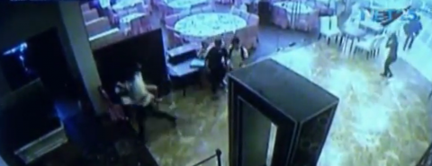 A grab from the CCTV footage of Resorts World Manila showing the lone gunman, Jessie Carlos, being accosted by a ladyguard after he did not pass through the metal detector. (Eagle News Service)